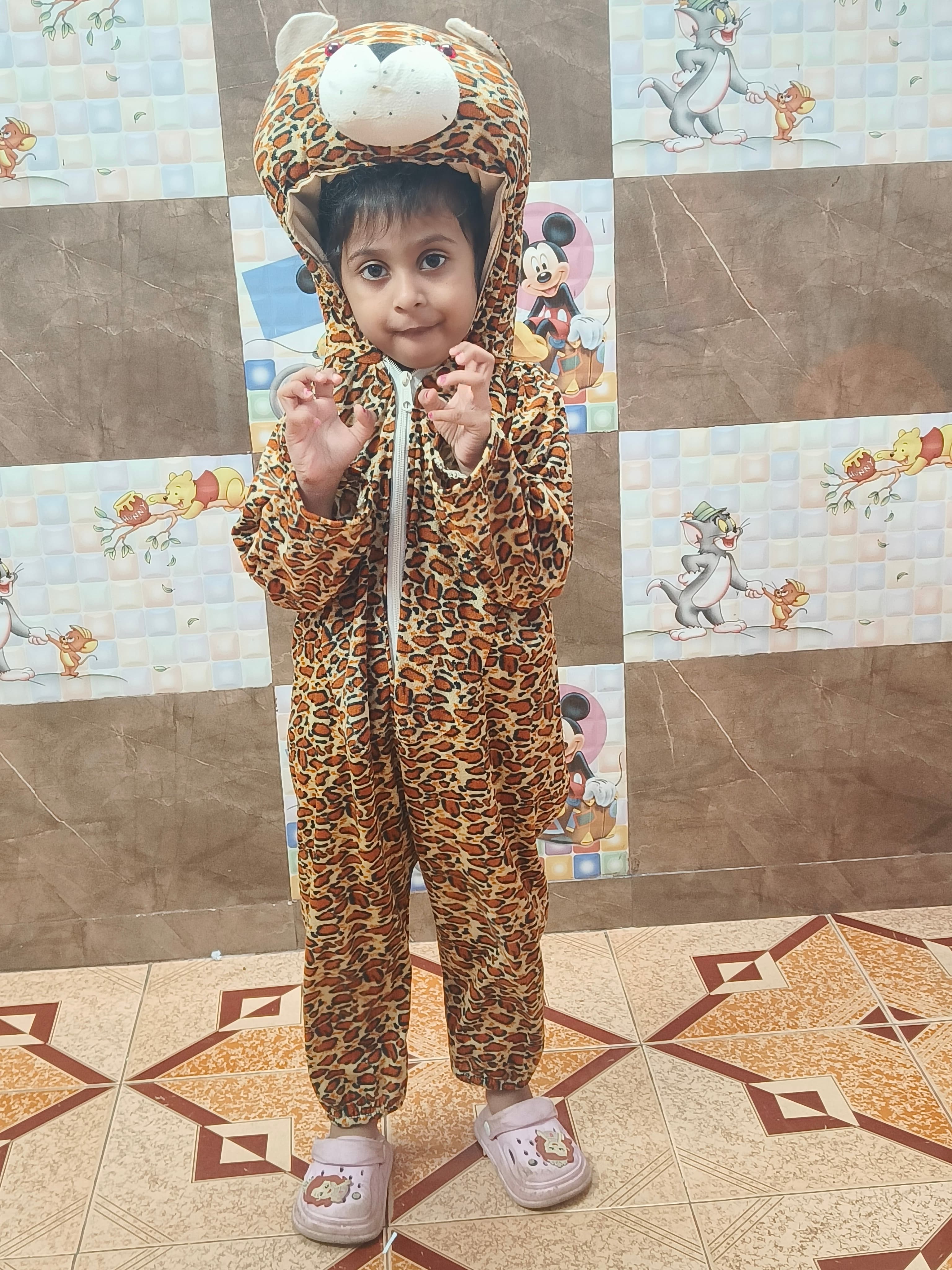Girl in leopard print costume with animal hood posing on Animal Day